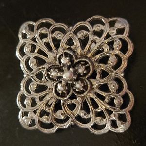 Beautiful ornate Broach with floral centerpiece